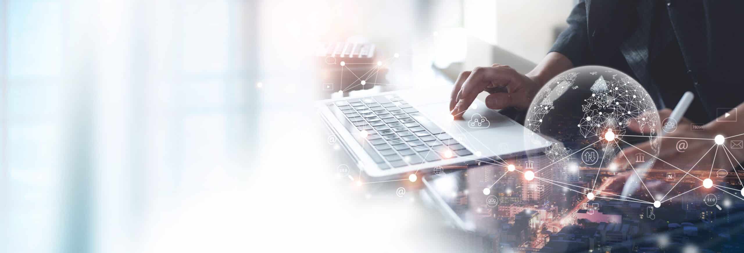 A person types on a laptop with digital network graphics and a globe overlay, suggesting global connectivity and modern technology. The scene is bright, with a blurred office background.